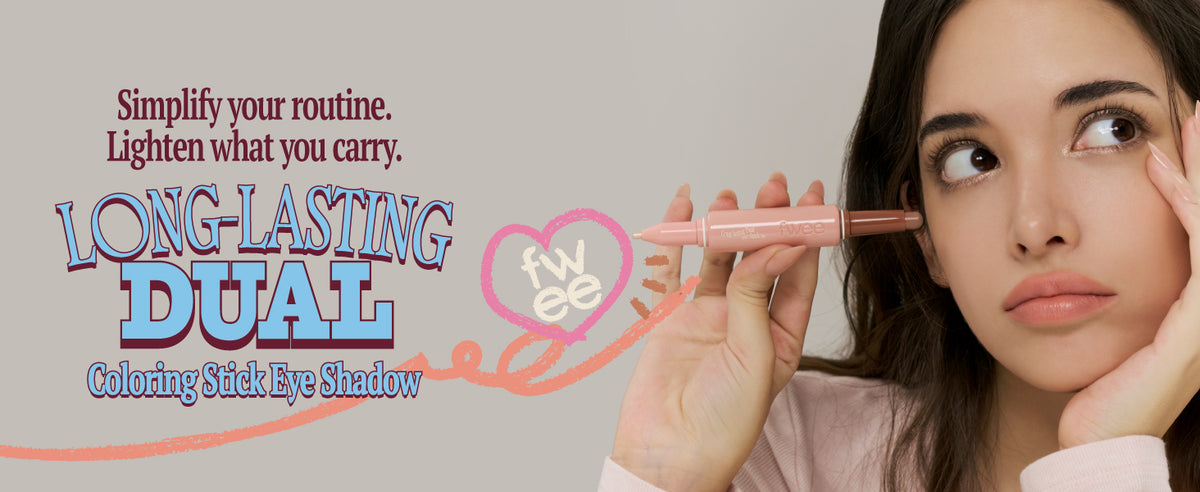 Woman applying eye shadow with a stick, promotional text for 'Long-Lasting Dual' coloring stick eye shadow.
